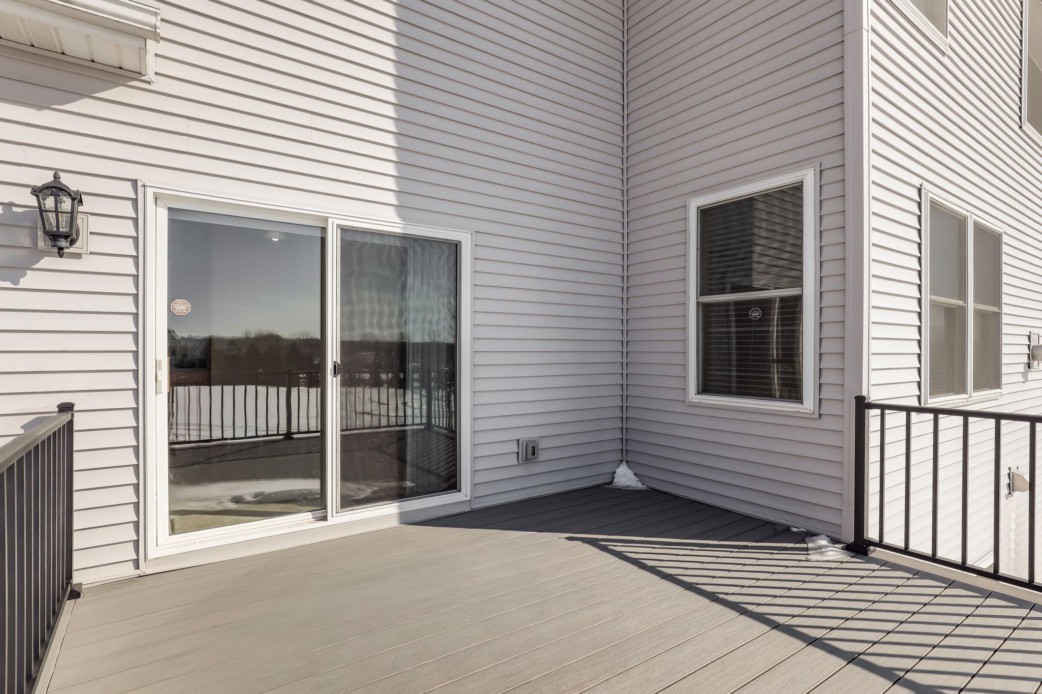 Newly surfaced maintenance-free composite deck with aluminum railing