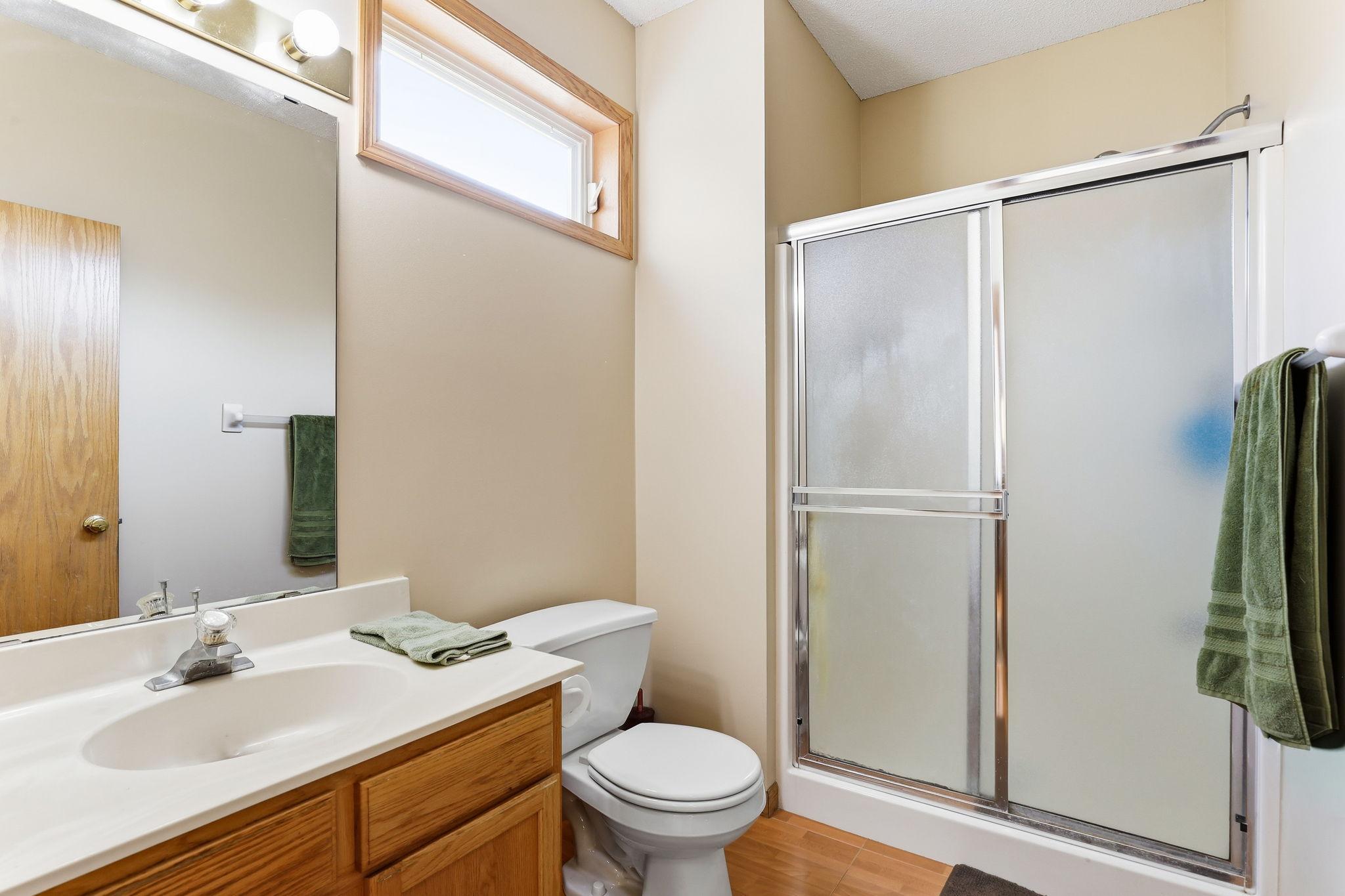 Main level 3/4 bathroom with walk-in shower