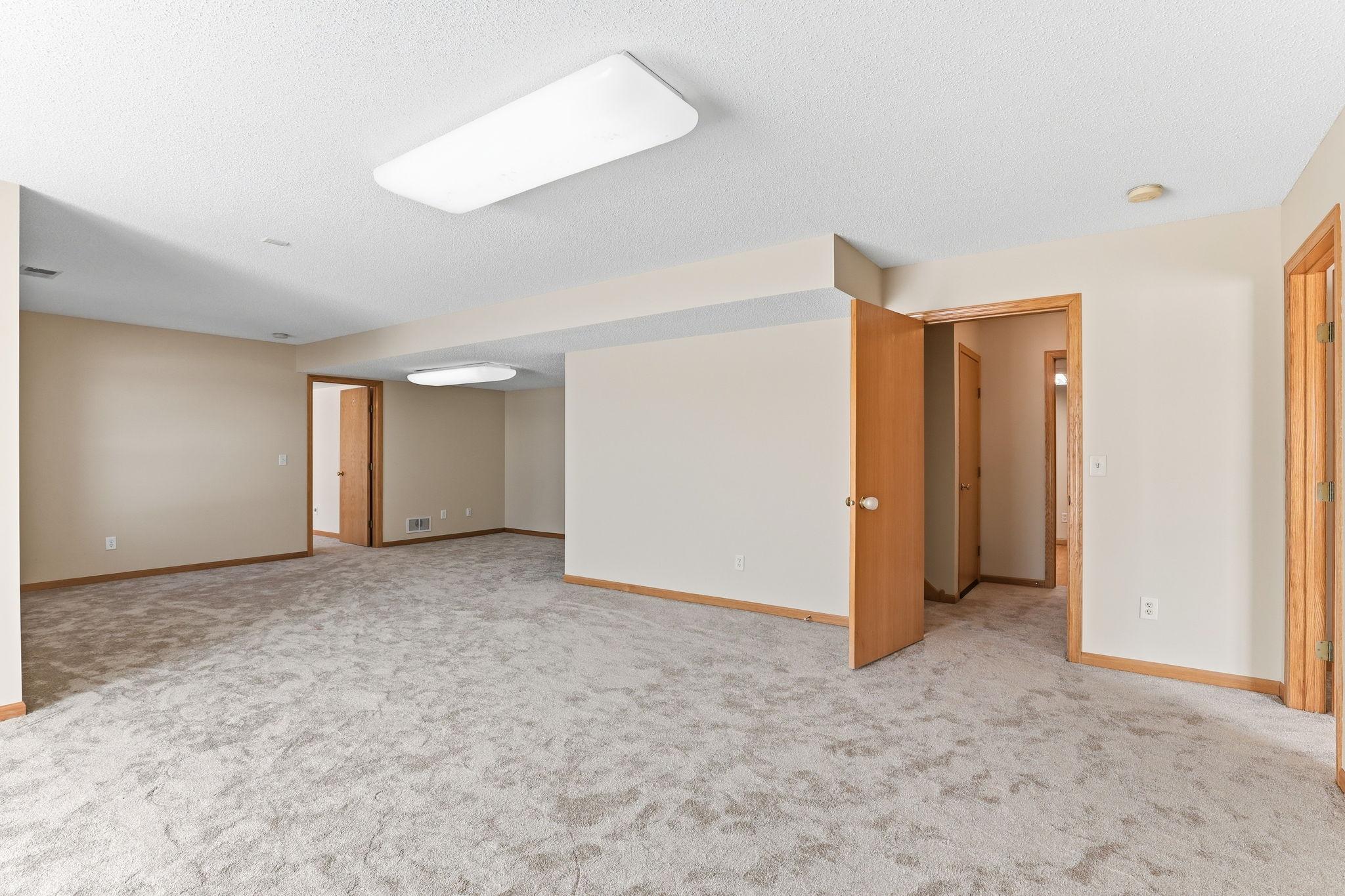 Lower level boasting two additional bedrooms and large storage room. Great potential for multi-generational living.