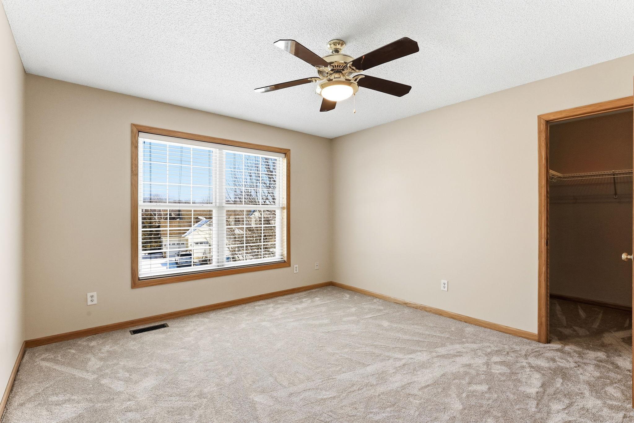Fourth upper level bedroom with walk-in closet