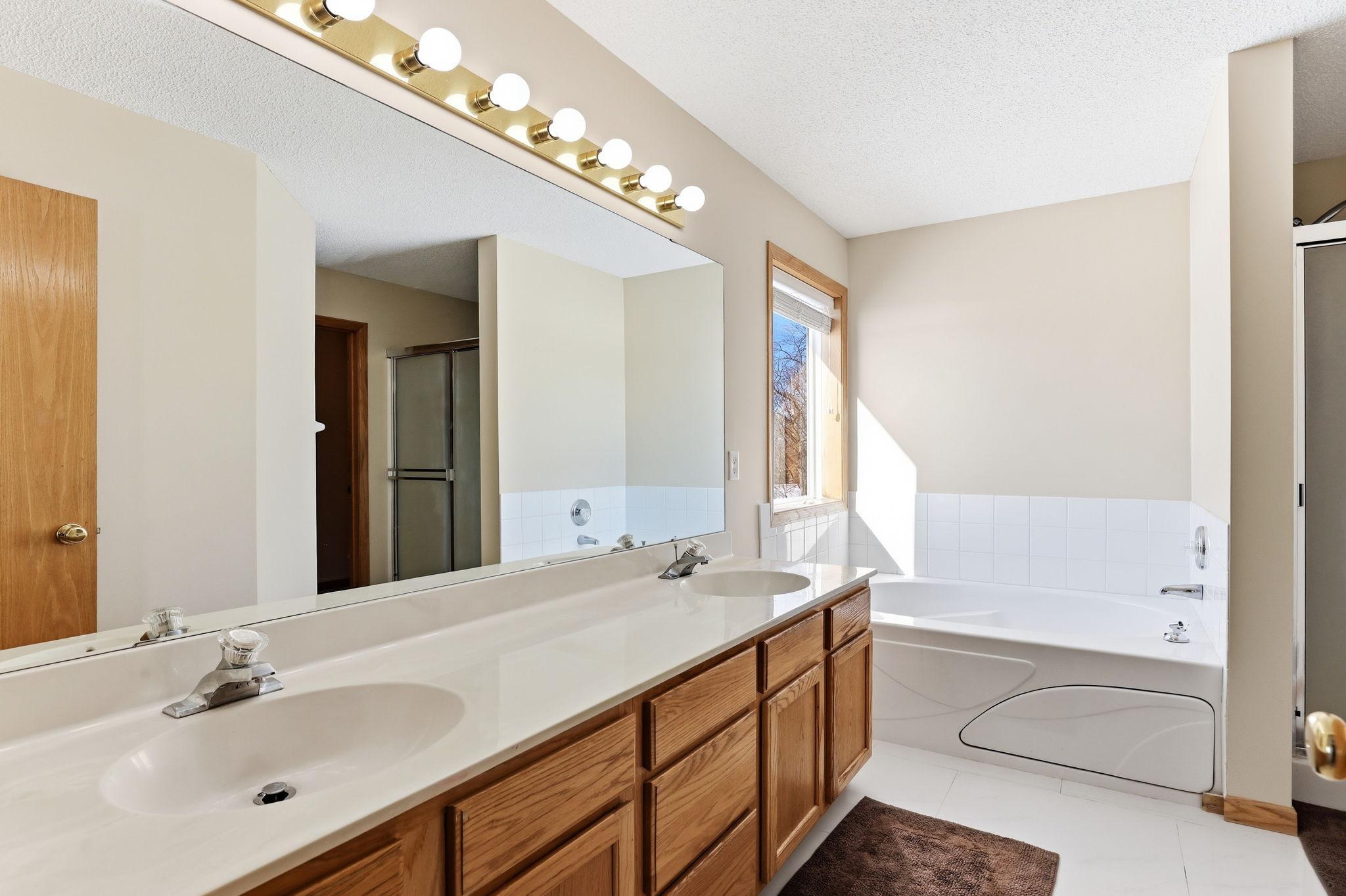 Primary bath with jacuzzi tub and 3/4 shower