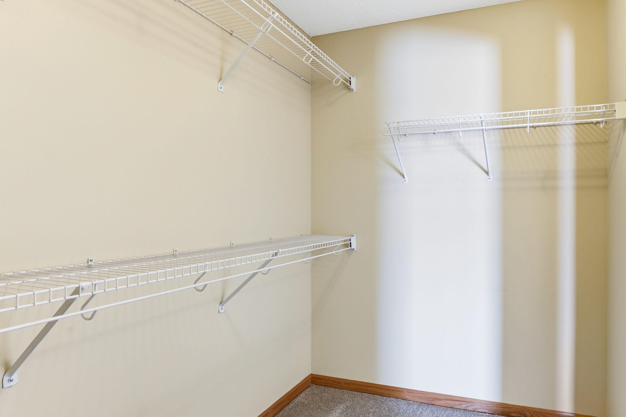 Spacious primary walk-in closet