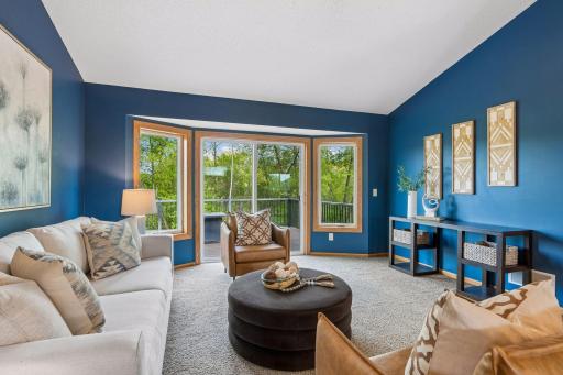 The Large sliding glass door and side windows allow natural light to flood the living room plus offer access to the maintenance free deck.