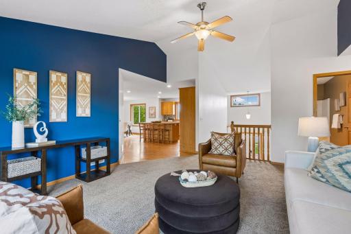 The large two story foyer walks up to the living room.