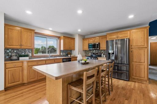 The beautiful kitchen boasts a large center island with plenty of room for entertaining.