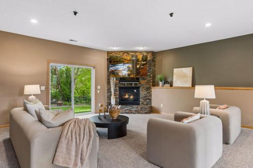 The huge lower level family room walks out to the back and boasts overhead recessed lighting, Gas fireplace and is wired for Surround sound.
