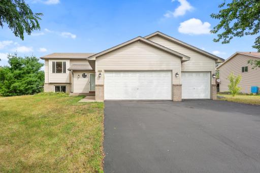 A full view of the front exterior and three-car garage