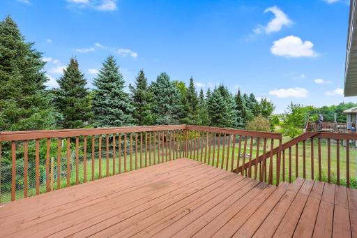 This is the kind of deck that makes you want to stay outside a little longerâcoffee in the morning, dinner in the evening, and the trees as your backdrop