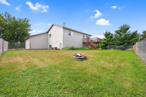 The backyard gives you room to enjoy the outdoors in more than one wayâdinner on the deck, a fire in the evening, or simply some open space to spend time outside