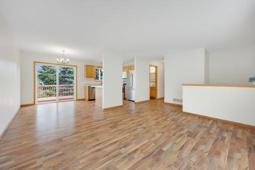 The main level feels open without feeling undefinedâthereâs room to gather, room to spread out, and an easy connection between the living area, kitchen, and dining space