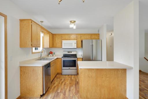 A closer look at the kitchen layout, with plenty of counter space and room to gather at the peninsula