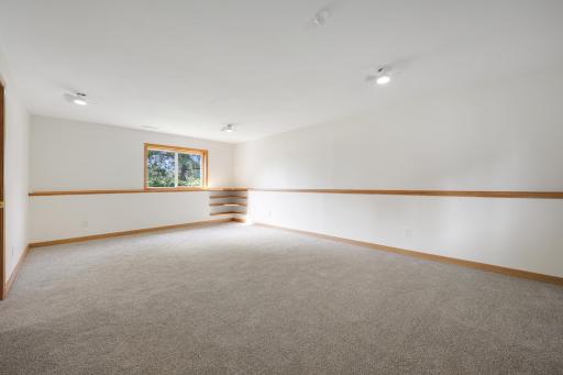 A wider view of the lower-level family room, showing just how much space there is to work with