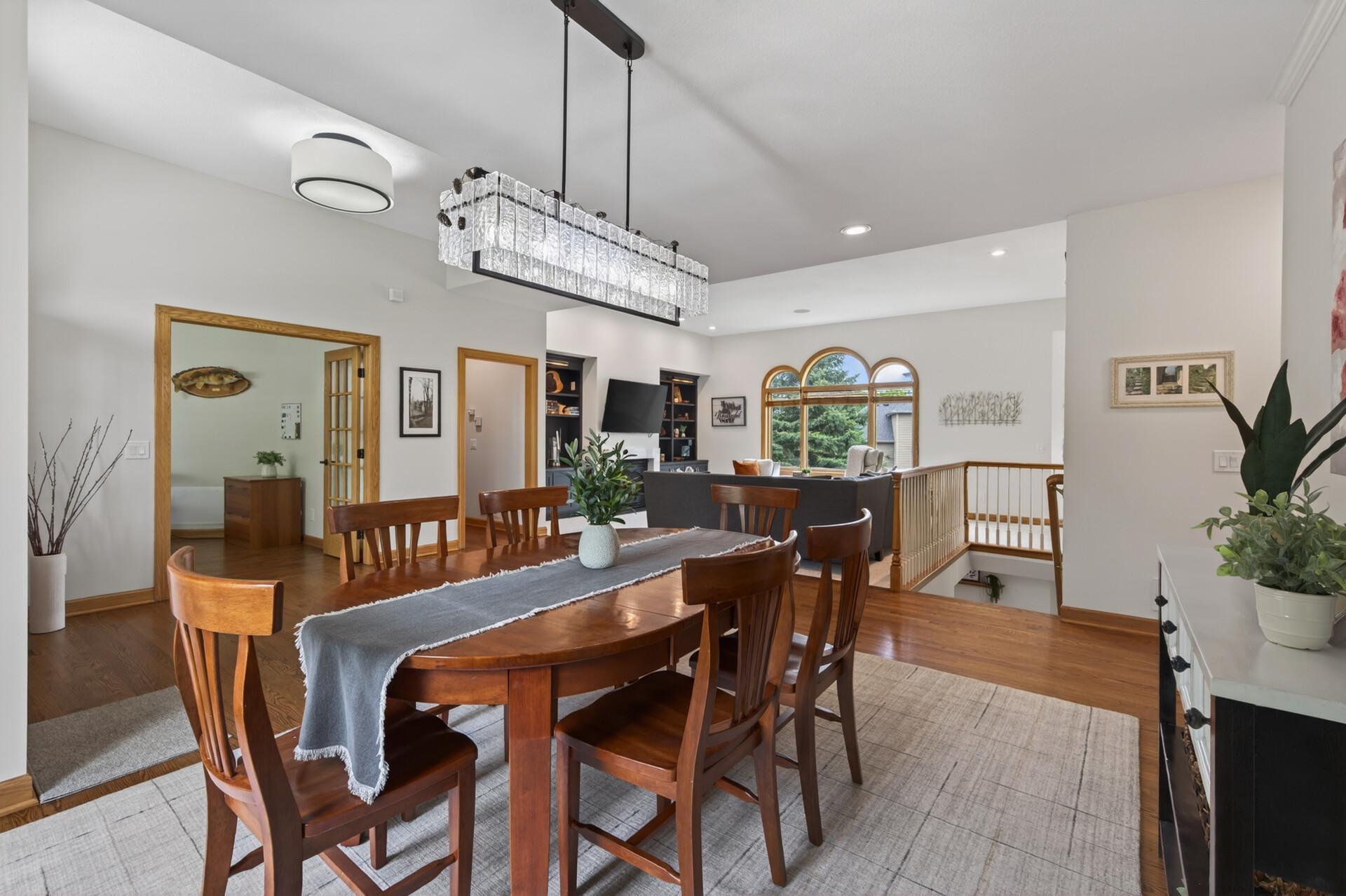 Formal dining room with updated lighting and open sightlines to the living room.