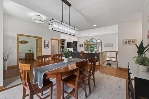 Formal dining room with updated lighting and open sightlines to the living room.