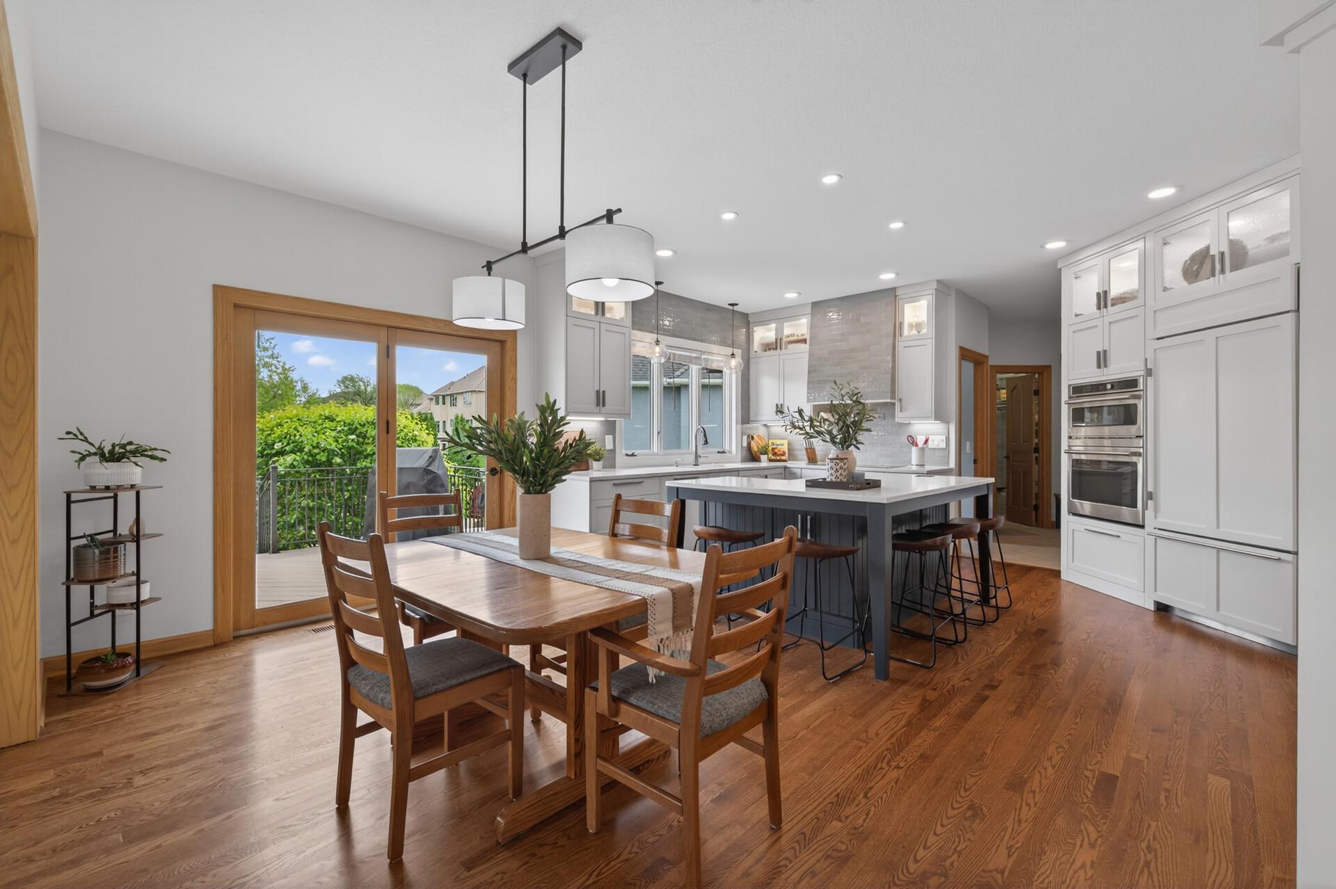 Informal dining area with deck access and open-concept kitchen layout.