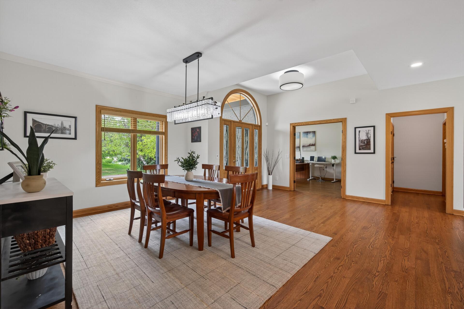 Open dining area connected to the grand foyer and main living spaces.