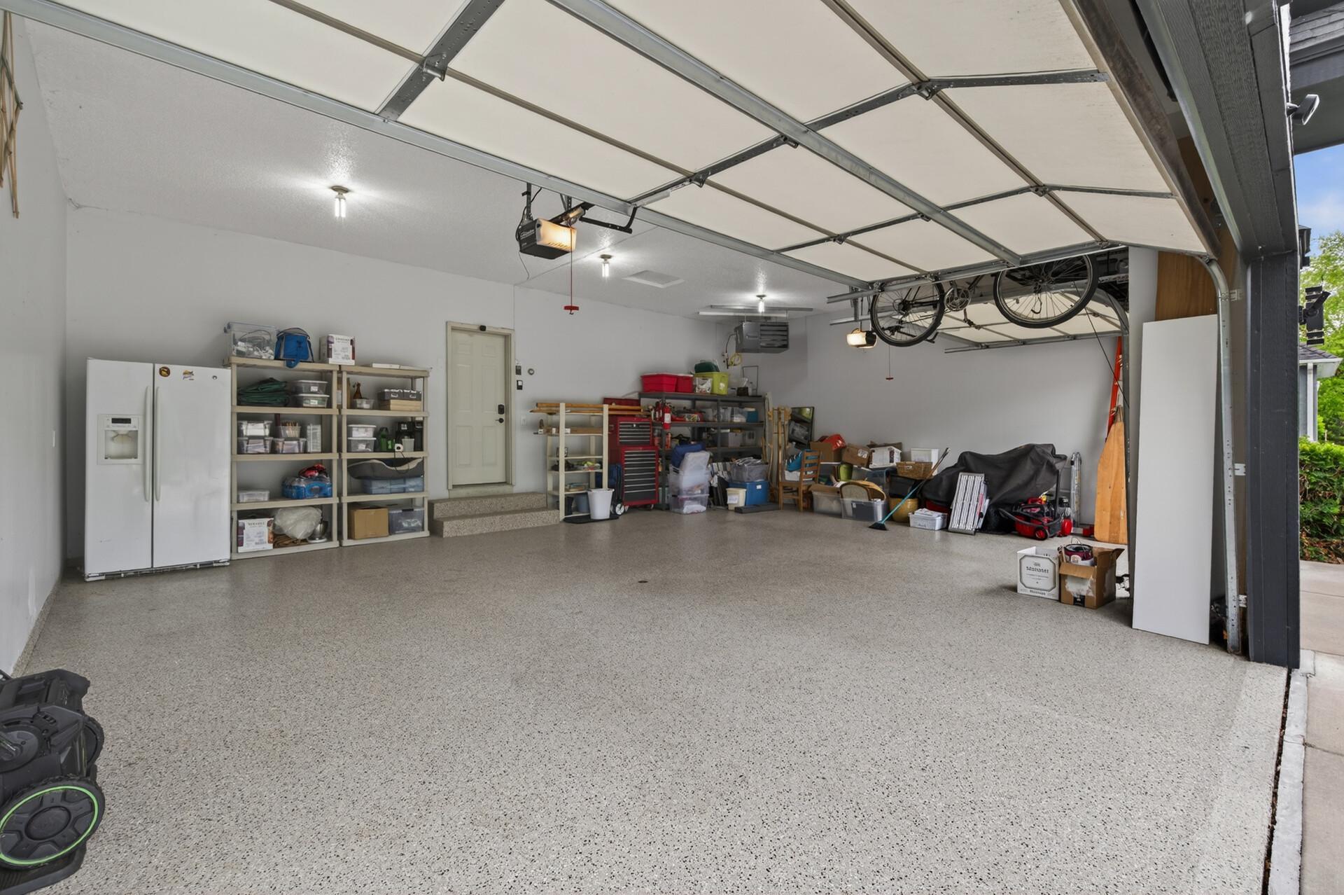 Oversized insulated garage with epoxy flooring, heat with room for storage