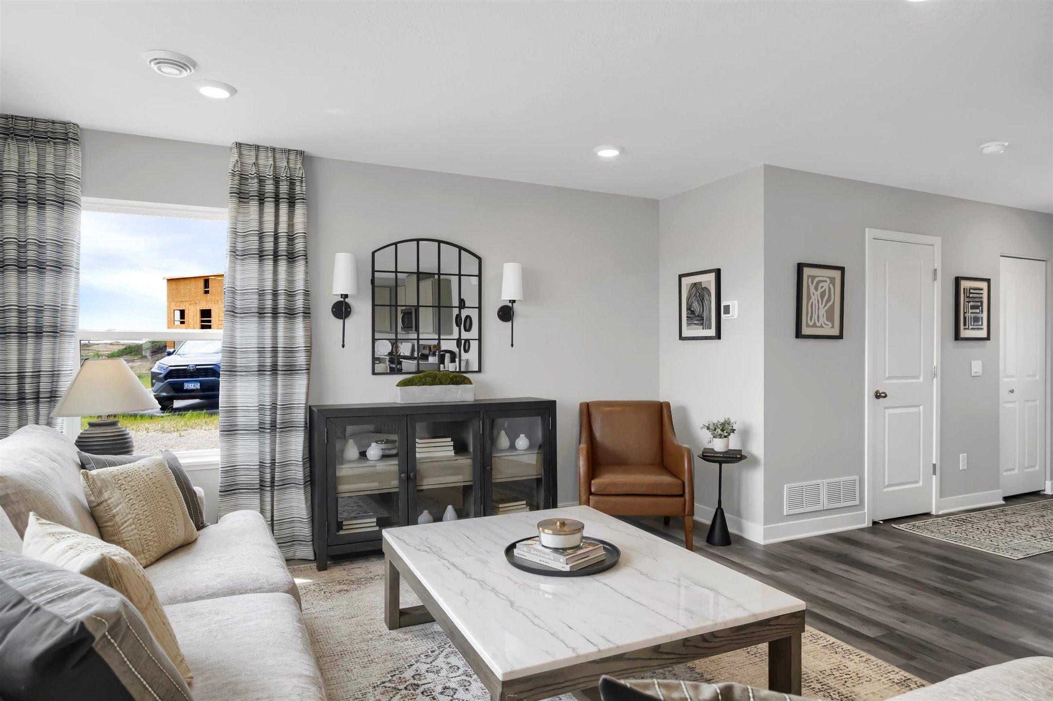 Every home is an end unit, which means more windows and light. (Model photo, colors may vary)