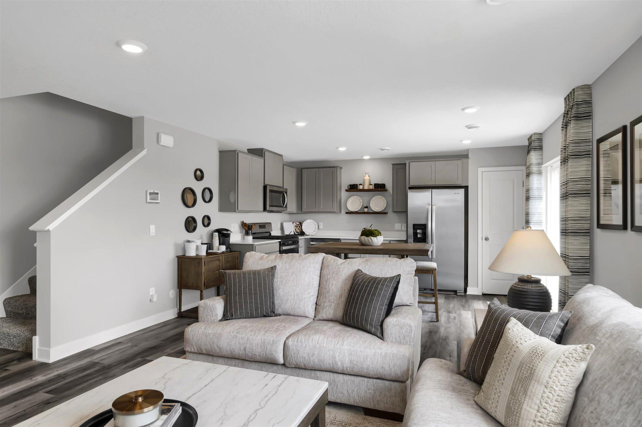 Welcome home to the Duet by D.R. Horton! Complete open concept main floor for all your entertaining needs! (Model photo, colors may vary)