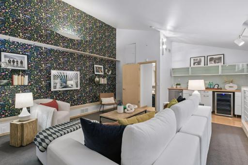 Family room with convenient kitchenette and beverage center.