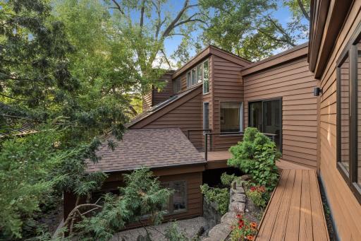 Private, wooded exterior with inviting deck access.