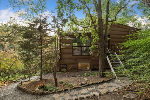 Secluded outdoor setting showcases the home's connection to nature and its terraced design.