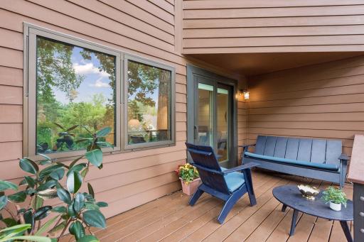 The covered deck offers a peaceful spot to relax and enjoy the wooded surroundings.