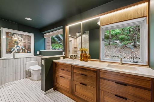 Spa-inspired primary bath with custom double vanity.