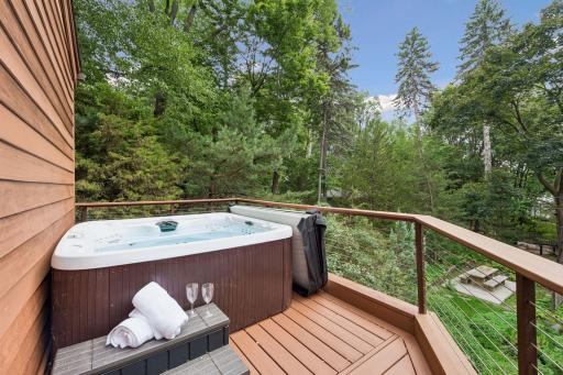 Enjoy the tree-filled views from the hot tub.