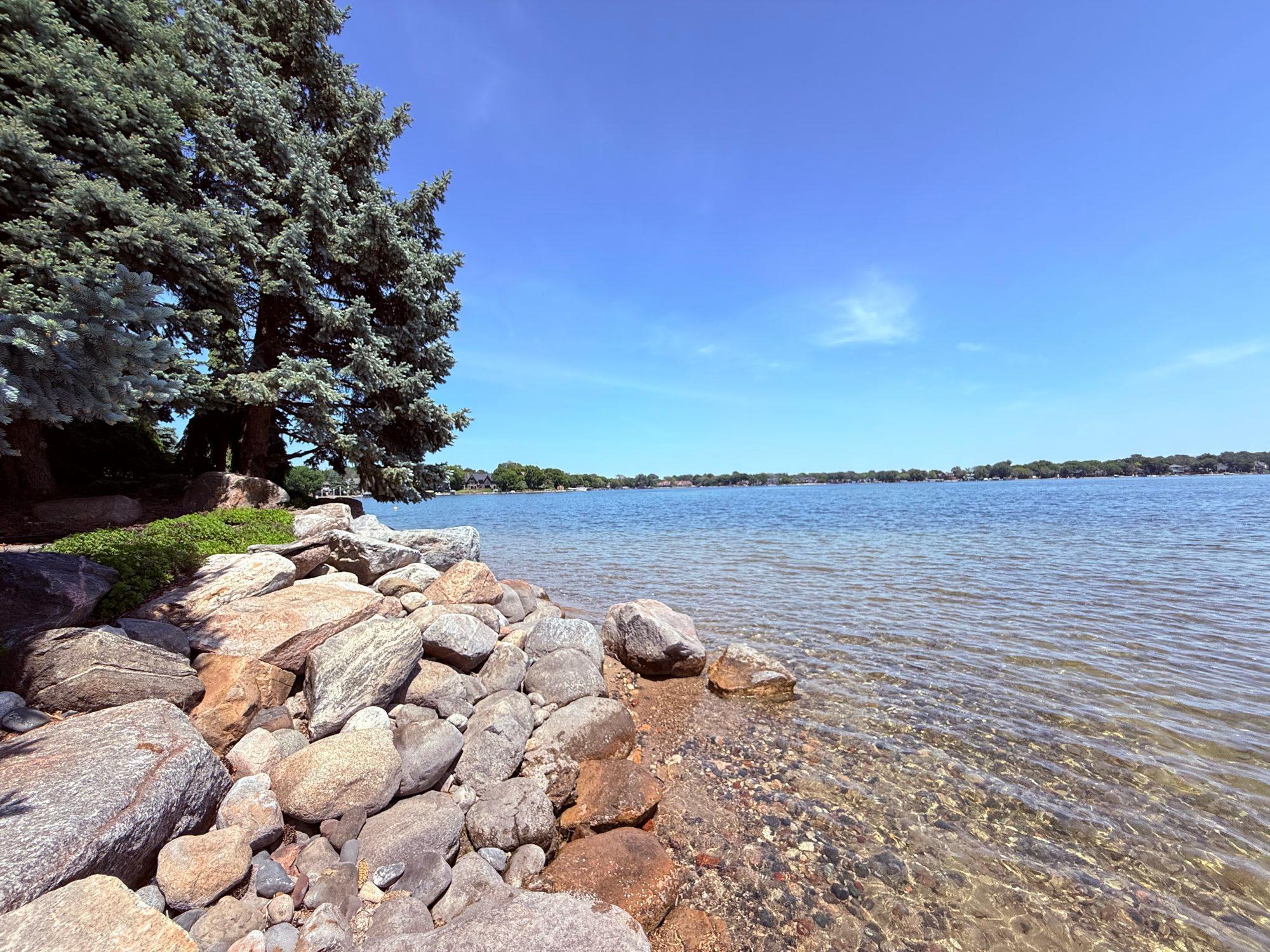 Large rip rap boulders around perimeter of shoreline