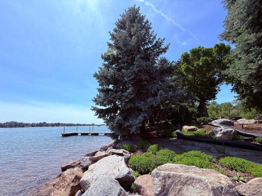 Large rip rap boulders around perimeter of shoreline