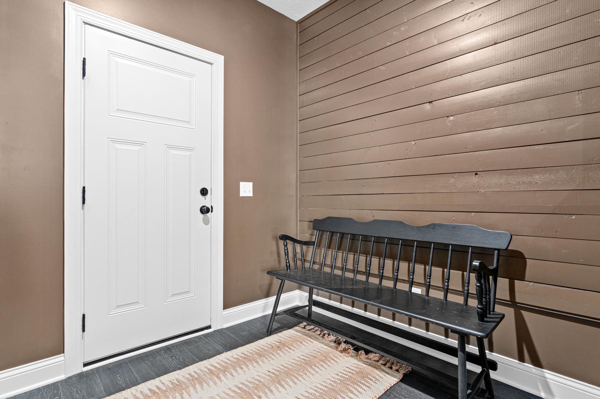 Mud room off the garage with walk in closet and pantry