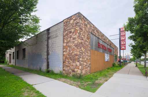 Front Corner Exterior with sign HondaTown 4215 E Lake St.png