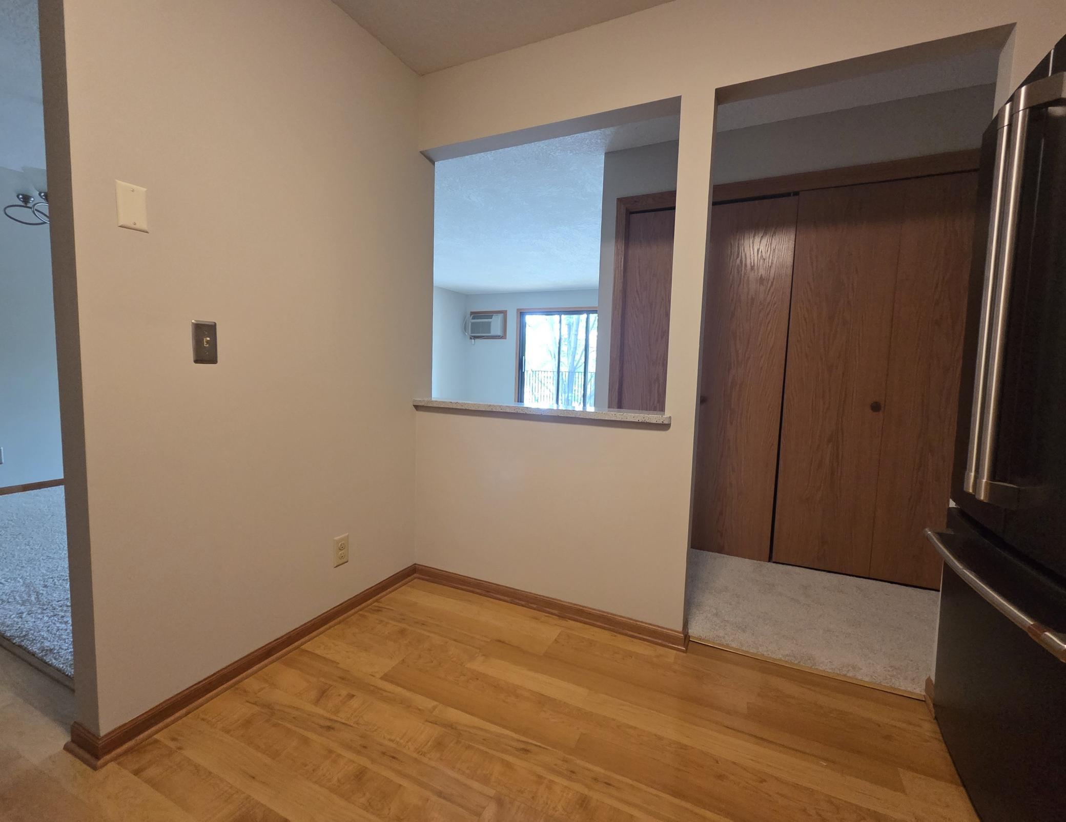 There is room in the kitchen for a small kitchen table.