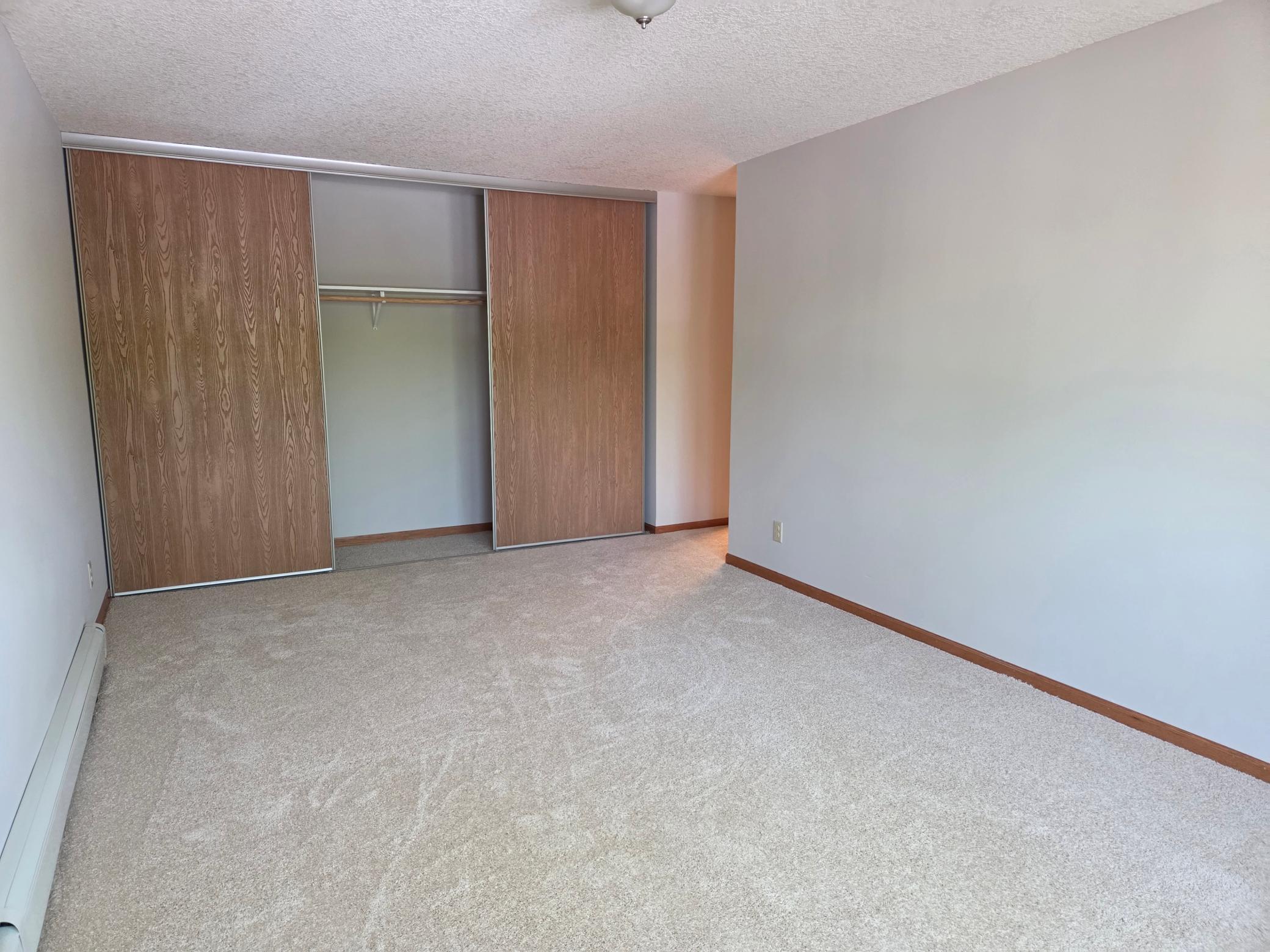 Very spacious primary bedroom. All the bedrooms & primary bath have very large closets- with extra height. This condo has loads of storage!