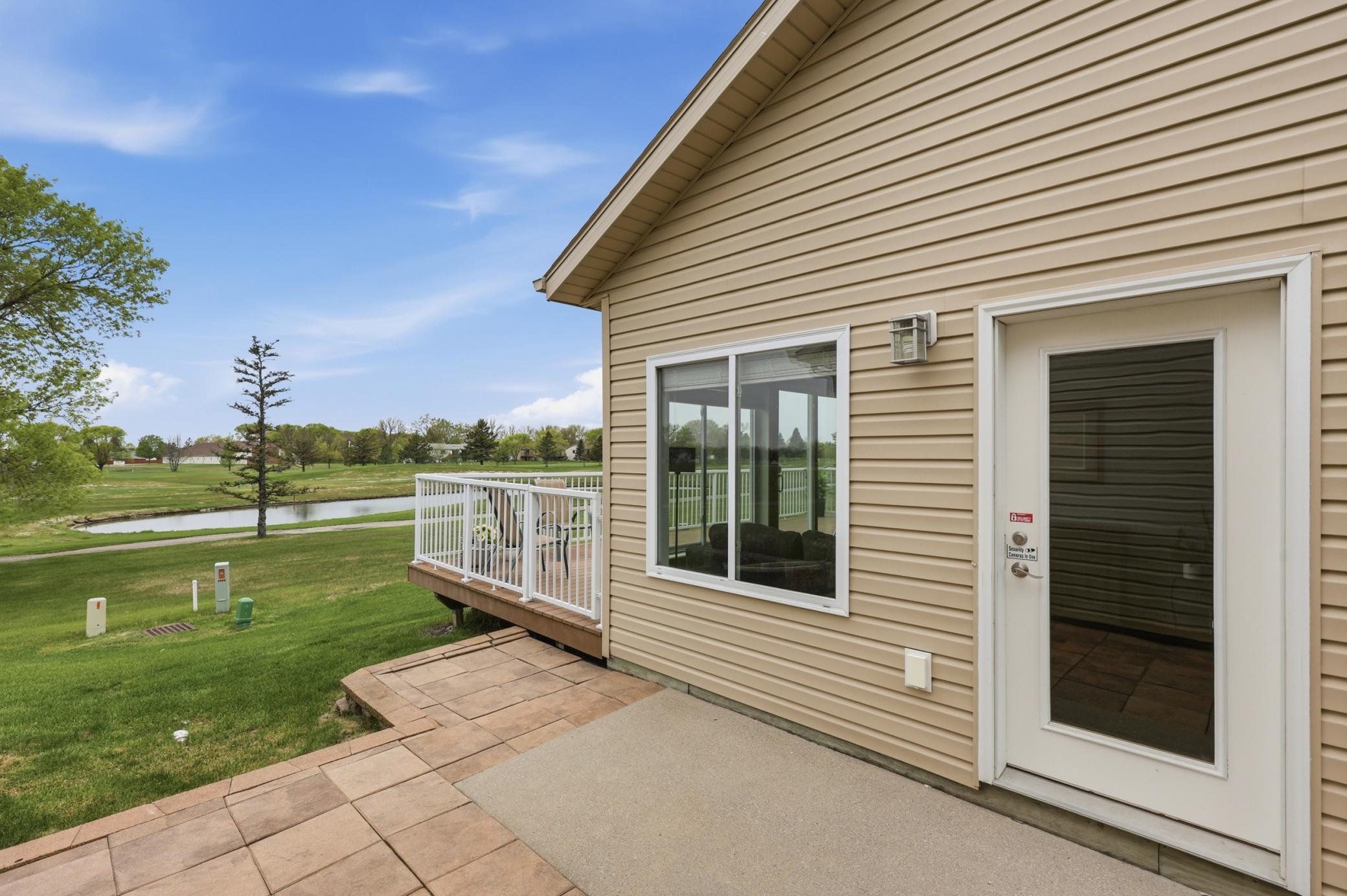 Patio to deck on 18th fairway of Village Green Golf Course