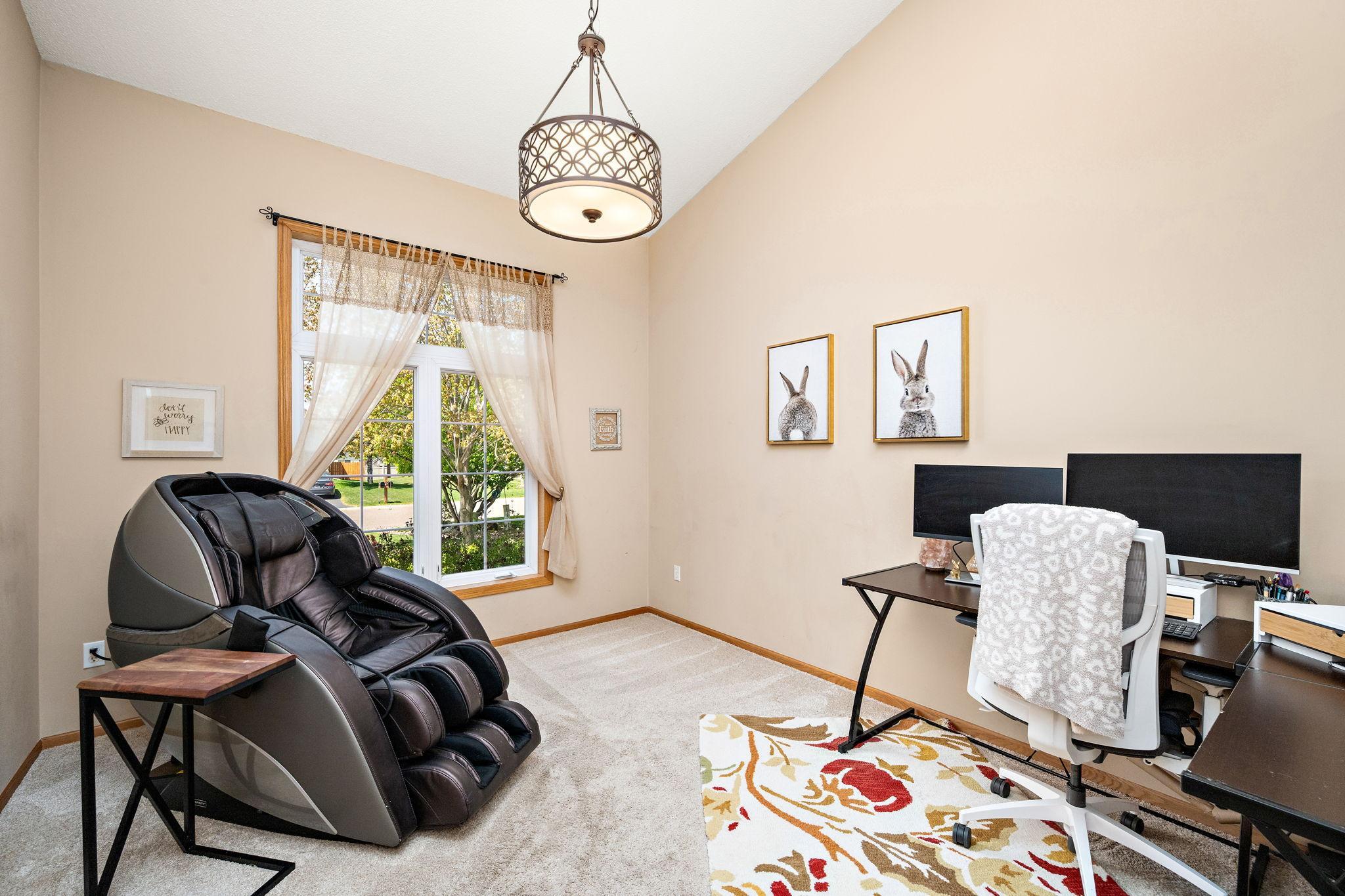 Office by front foyer with french doors