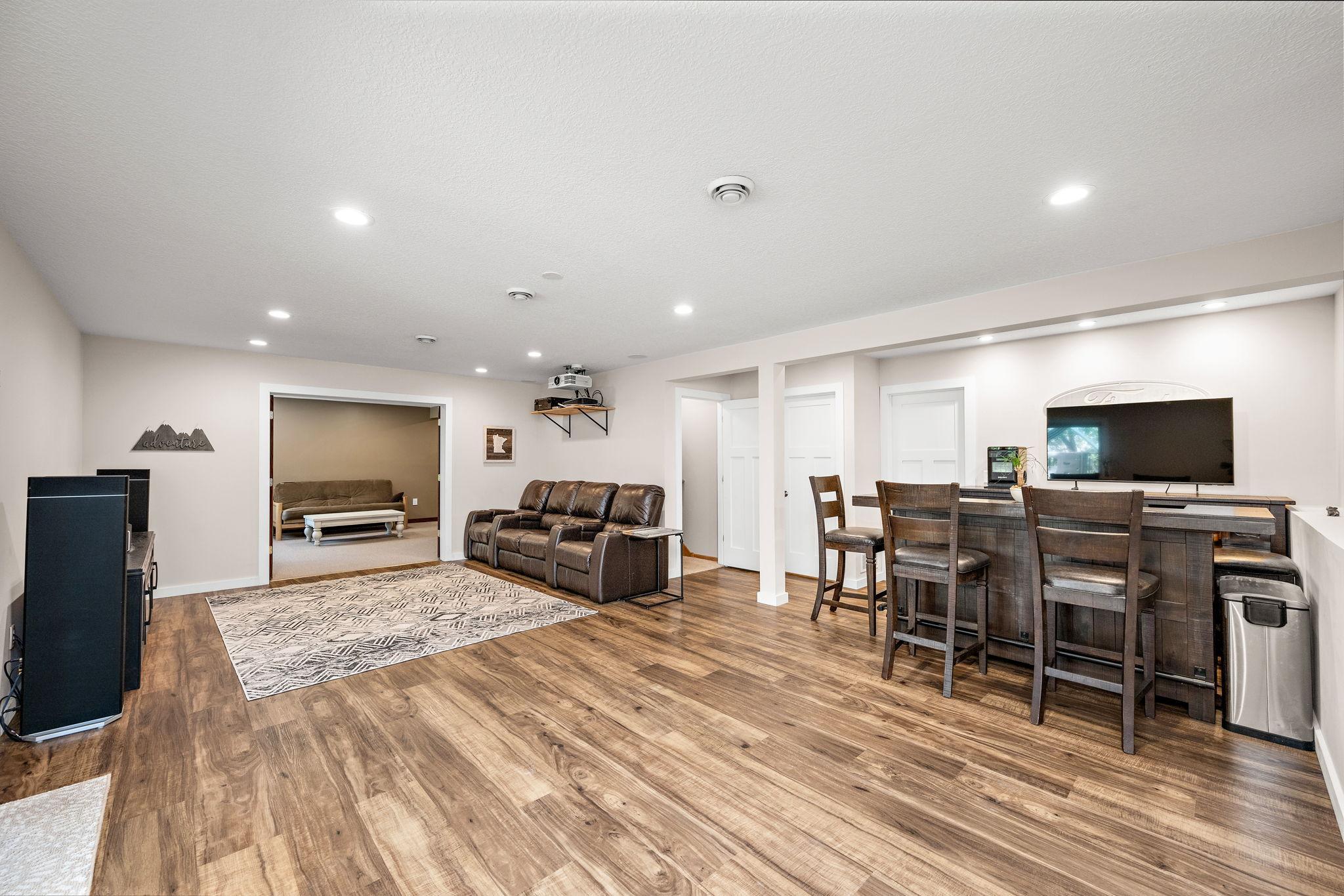 Lower level family room walks out to beautiful stamped concrete patio