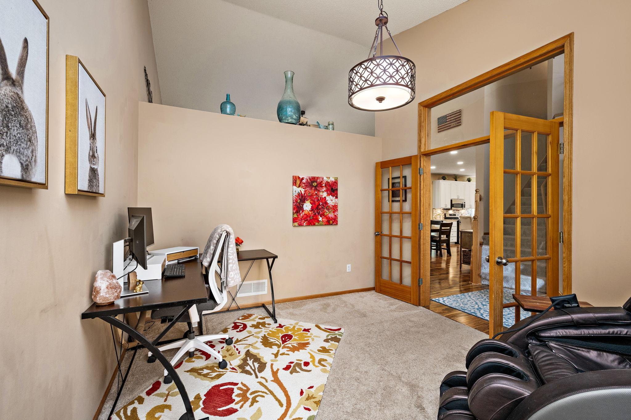 Office by front foyer with french doors