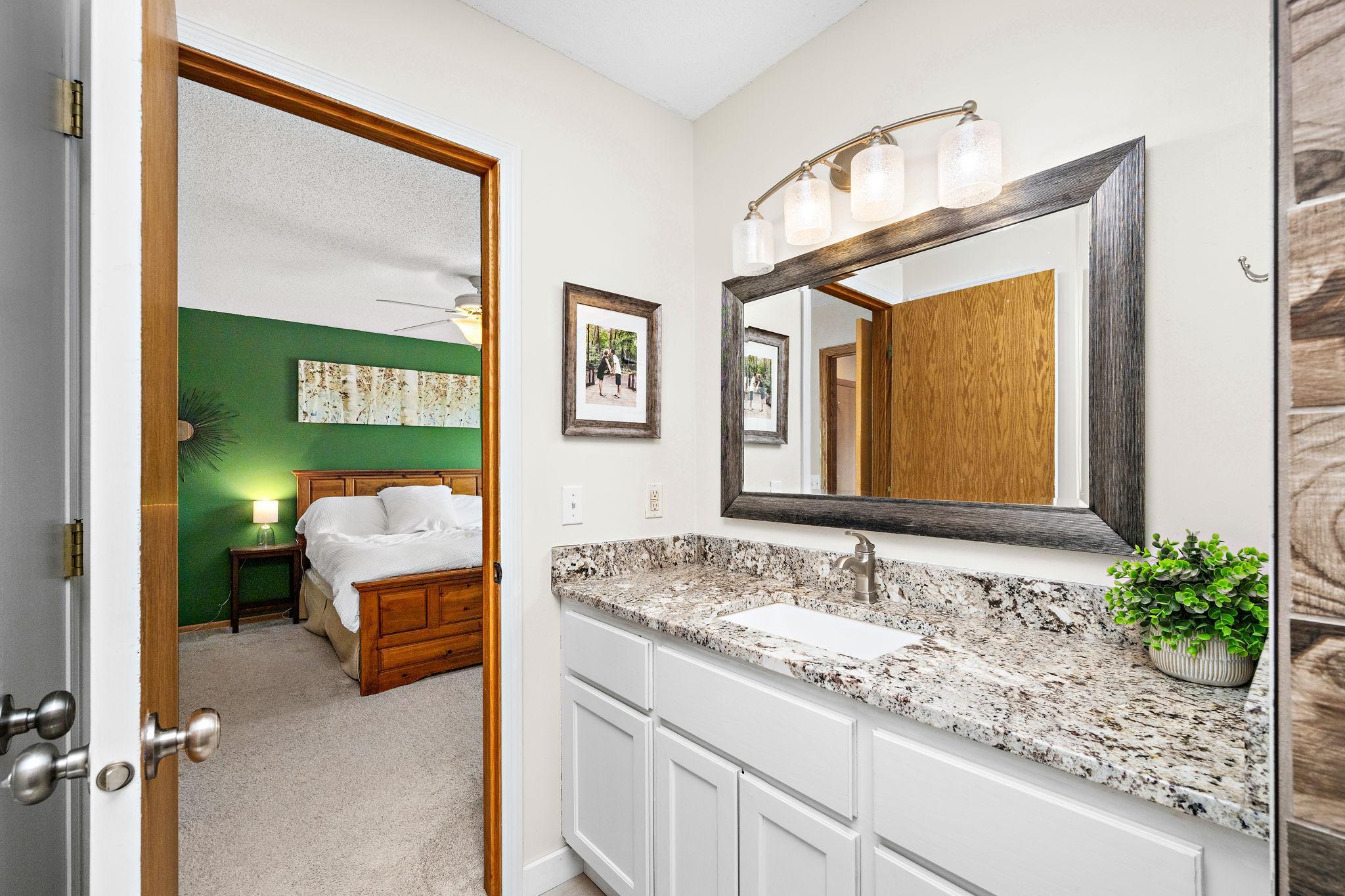 3/4 primary bath with granite countertop