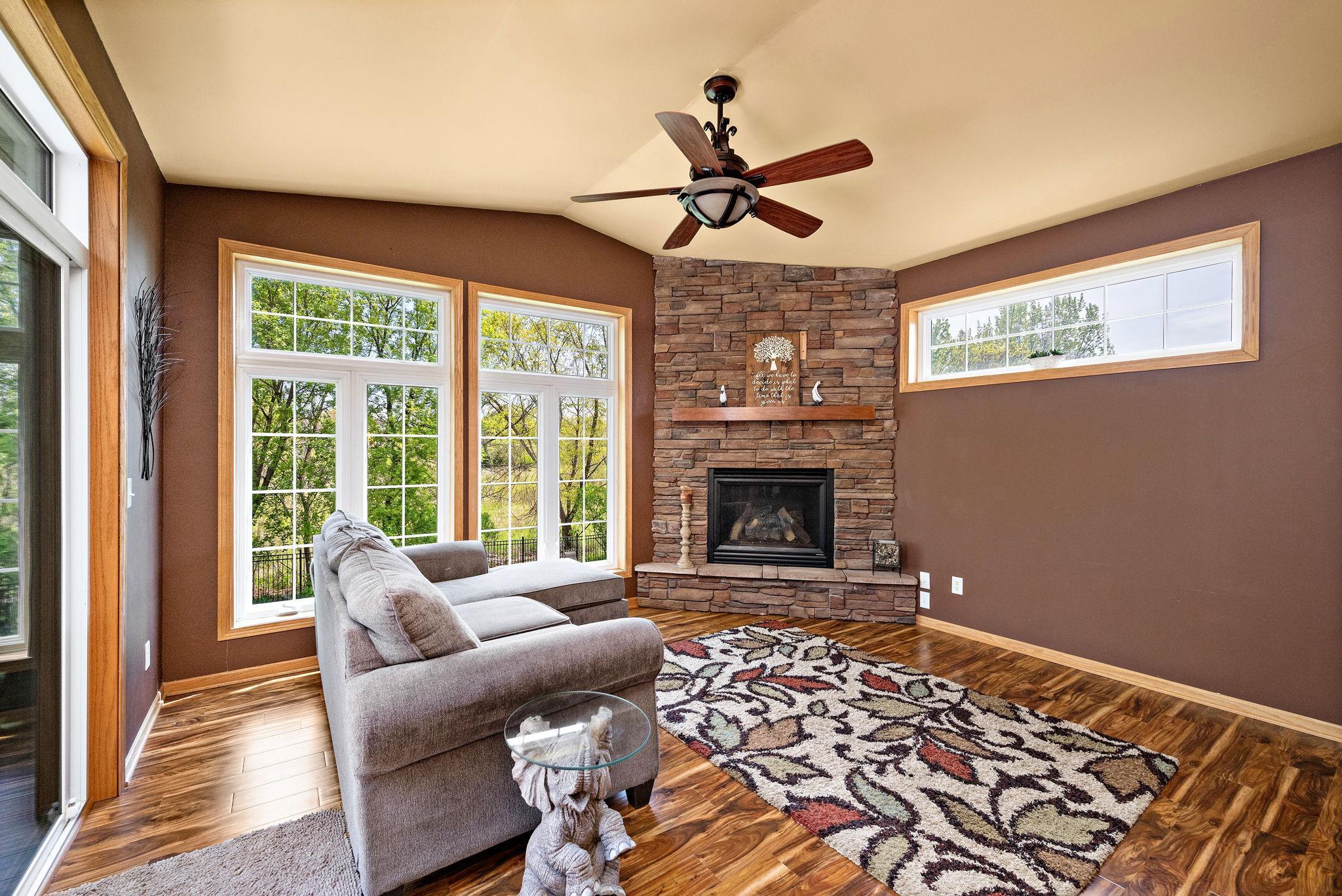 Four season has gas fireplace, large windows, and walkout to deck
