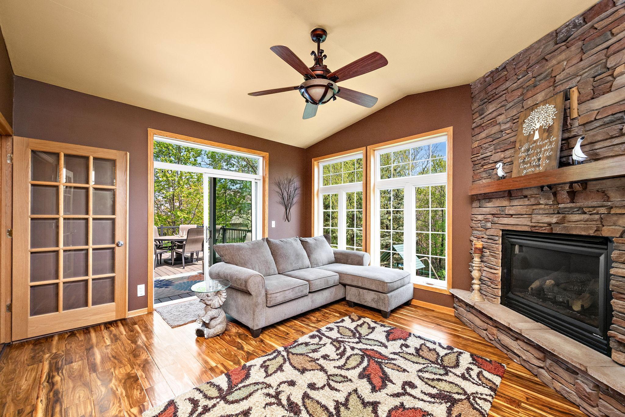 Four season has gas fireplace, large windows, and walkout to deck