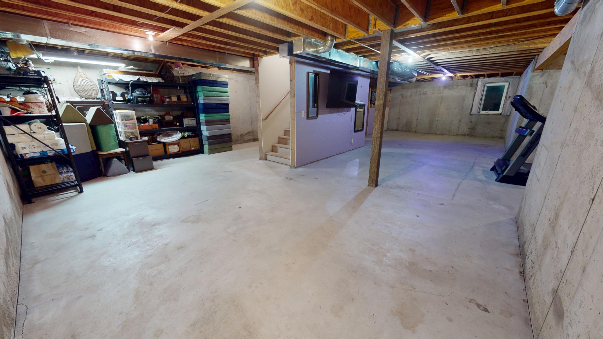 Unfinished Basement with Egress and Plumbing.jpg