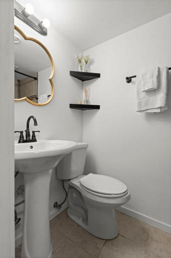 Beautifully updated Â¾ basement bathroom with elegant tile finishes