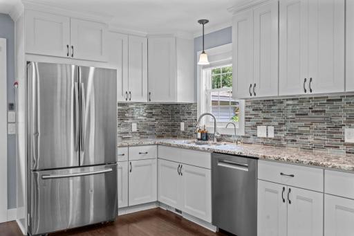 Stylish tiled backsplash and kitchen window.