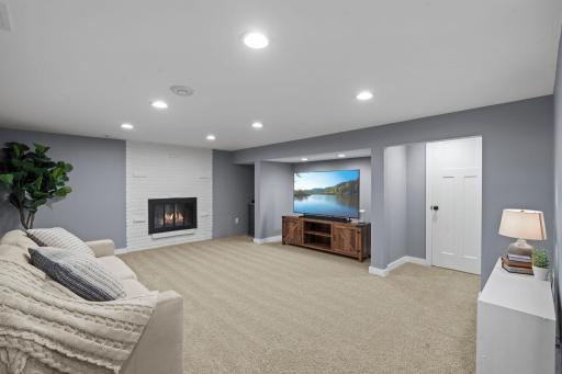 Retreat to the spacious finished lower level featuring a second brick fireplace, versatile living space, two additional bedrooms with egress windows, and a beautifully updated Â¾ bath with elegant tile finishes.