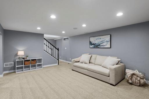 Retreat to the spacious finished lower level featuring a second brick fireplace, versatile living space, two additional bedrooms with egress windows, and a beautifully updated Â¾ bath with elegant tile finishes.