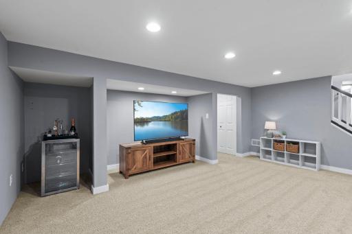 Retreat to the spacious finished lower level featuring a second brick fireplace, versatile living space, two additional bedrooms with egress windows, and a beautifully updated Â¾ bath with elegant tile finishes.
