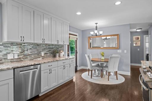 The informal dining area offers two separate walkouts to the backyard and garage.