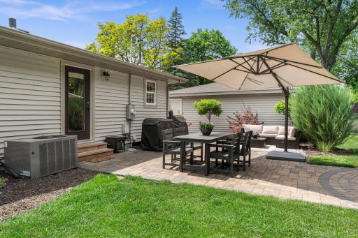 Enjoy easy indoor-outdoor living with two main-level walkouts leading to inviting backyard patios.